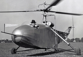 Igor Sikorsky, wearing his trademark fedora, at the controls of the VS-300. The VS-300 formed the basis for the V-316 and R-4. (Sikorsky Archives)